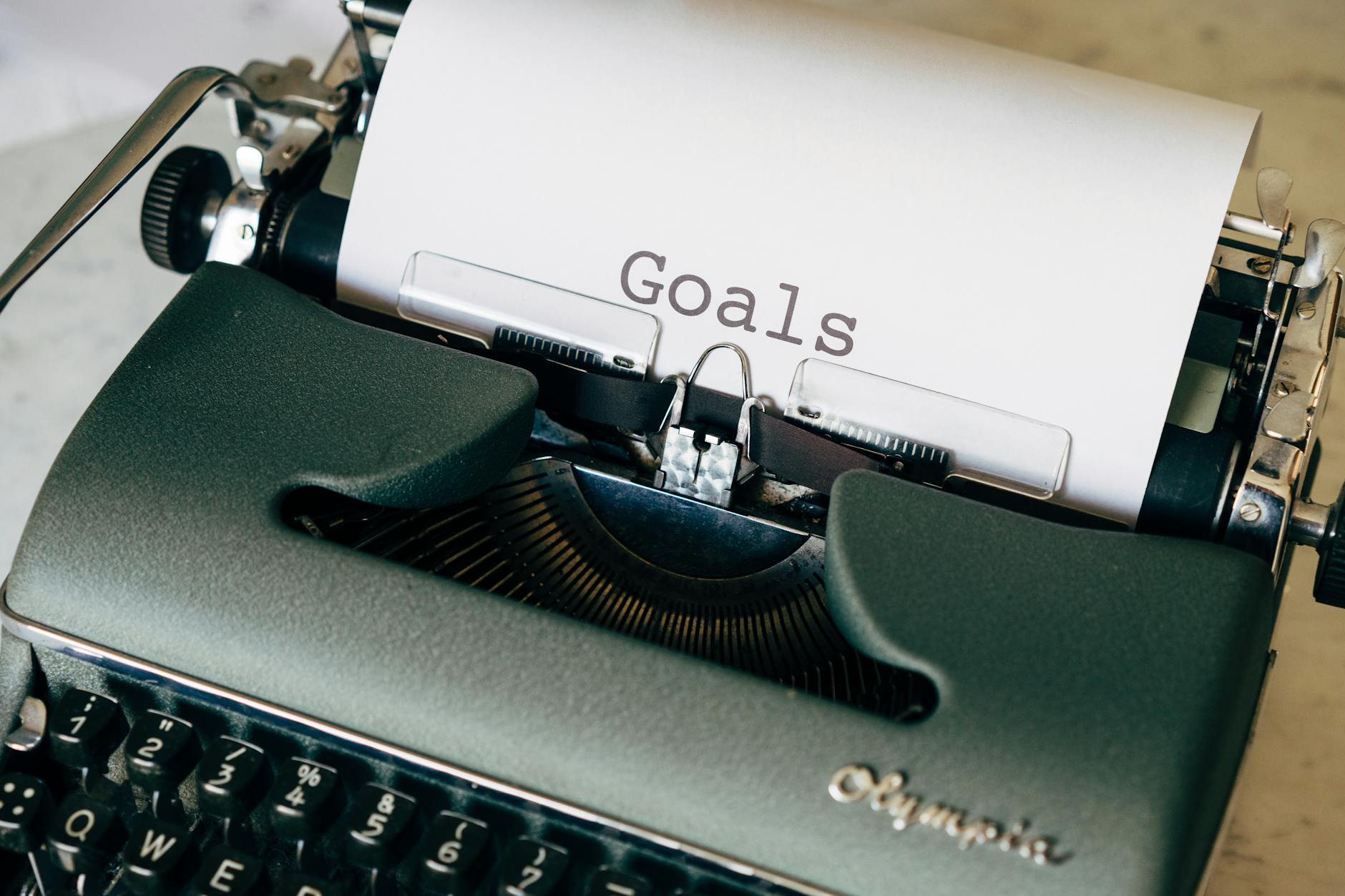 Typing machine goals symbolizing SMART goals planning and achievement
