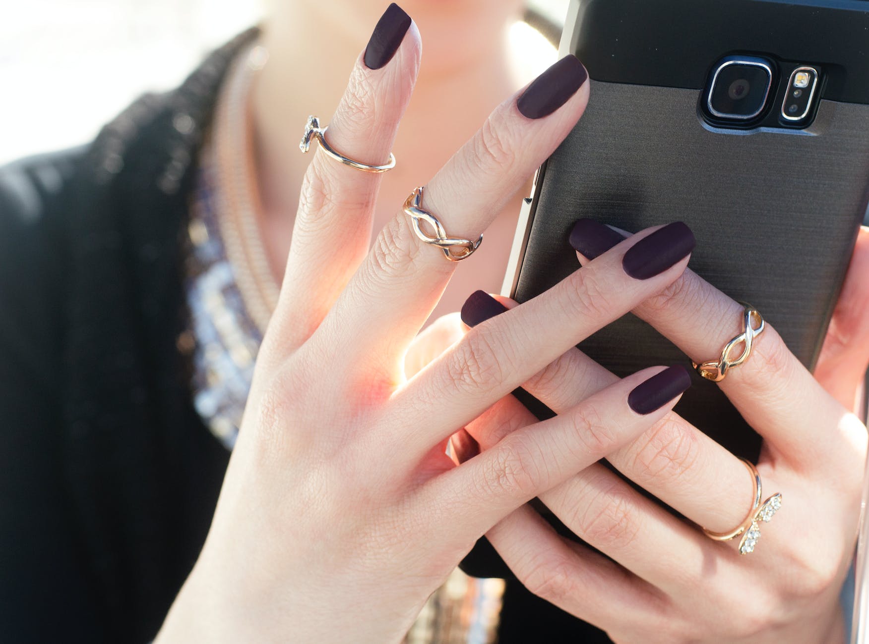 four gold colored rings