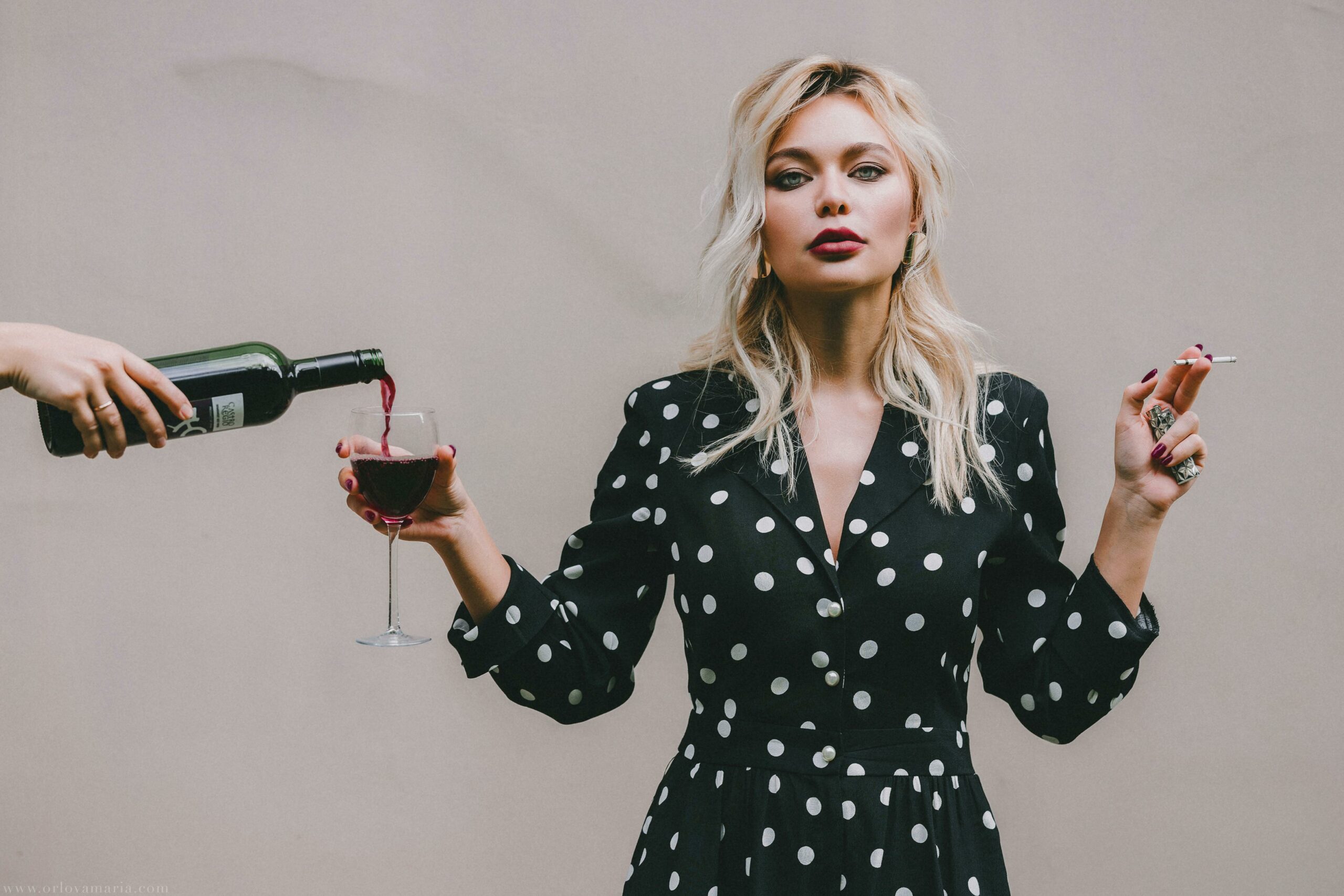 woman holding a glass of wine