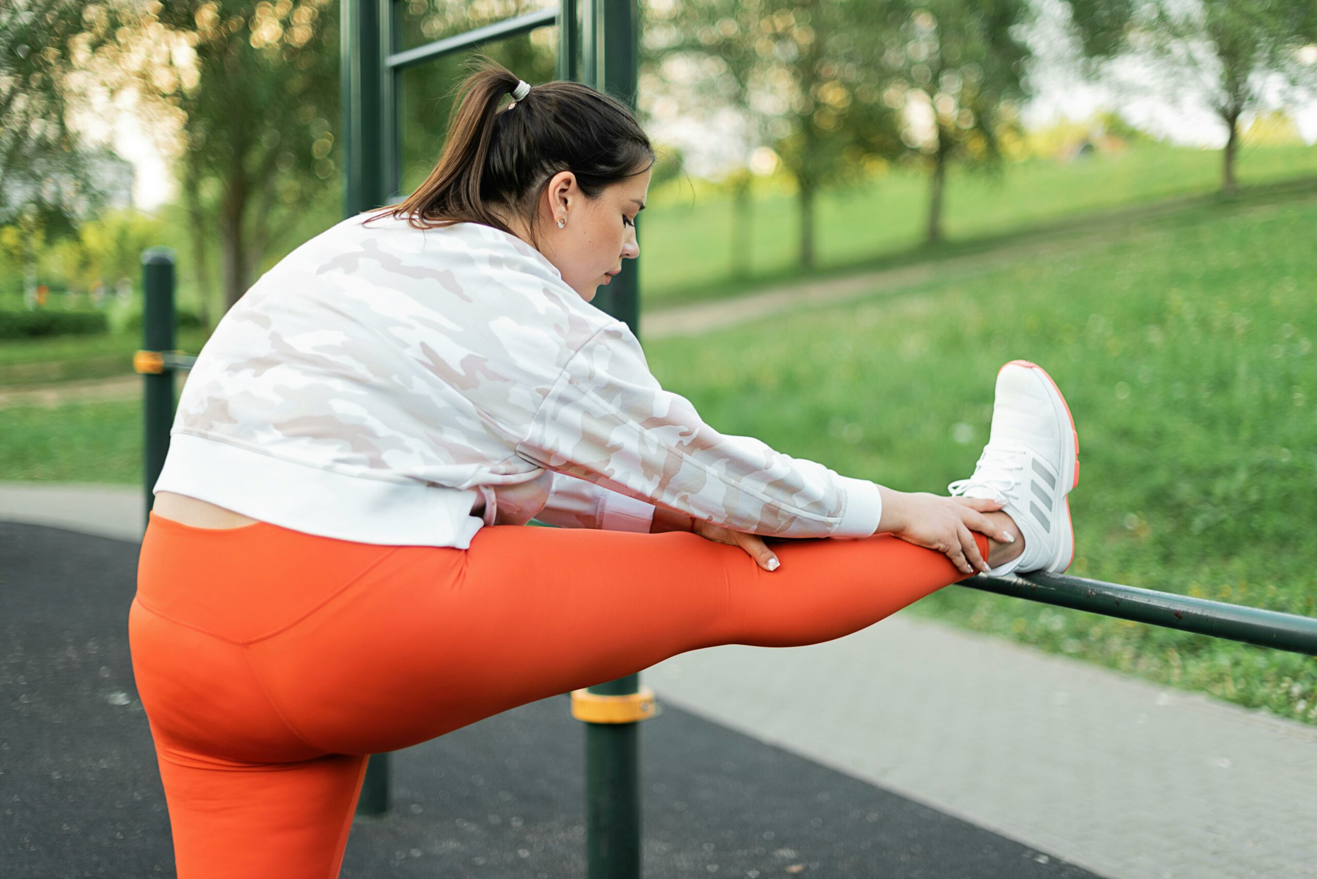 woman exercising in the park representing how to exercise when you are out of shape