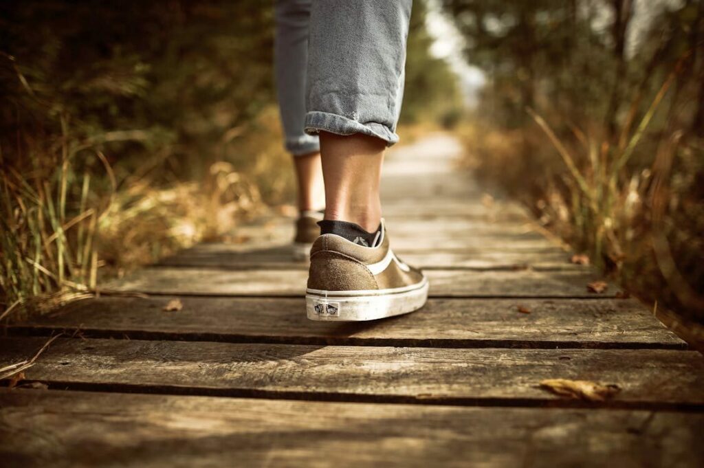 picture of the feet of someone walking representing the benefits of walking