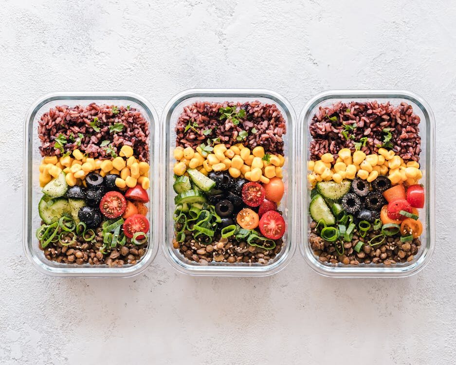 A visual guide to meal planning, featuring a colorful meal prep container filled with various healthy ingredients. This image represents the concept of planning, prepping, and eating nutritious meals for a simplified and healthier lifestyle.