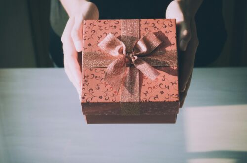 someone holding a gift representing a gift selected from some gift ideas